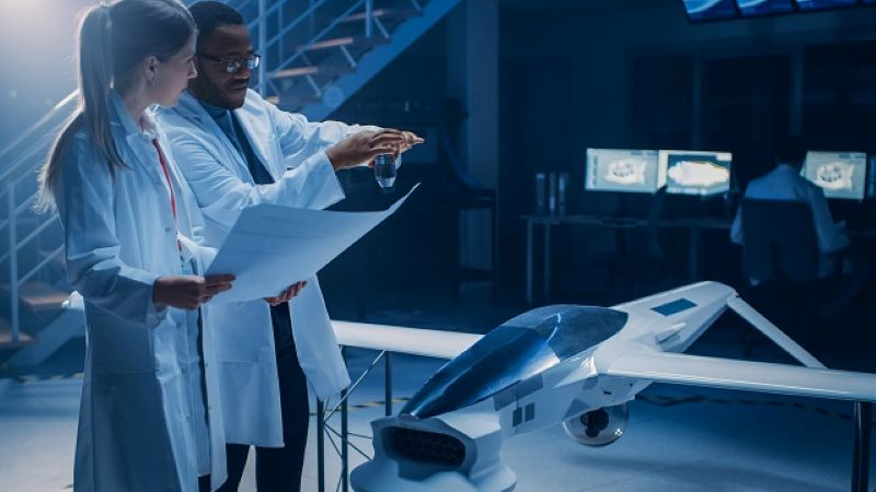 Two Aerospace Engineers Work On Unmanned Aerial Vehicle / Drone Prototype