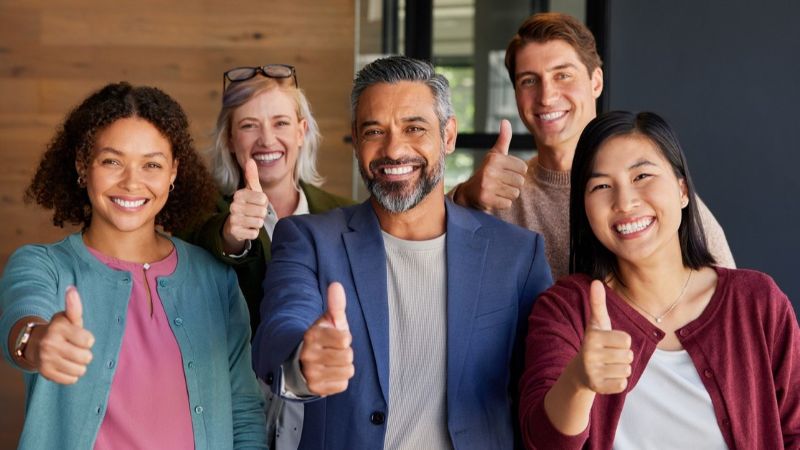 Group of people giving thumbs up