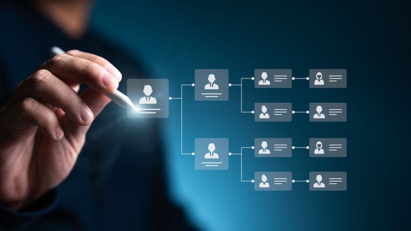 Man working on an org chart with a stylus